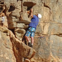 Alfred in the rocks on a challenging part. Note: The two horizontal lines are electricity cables - far away from Alfred